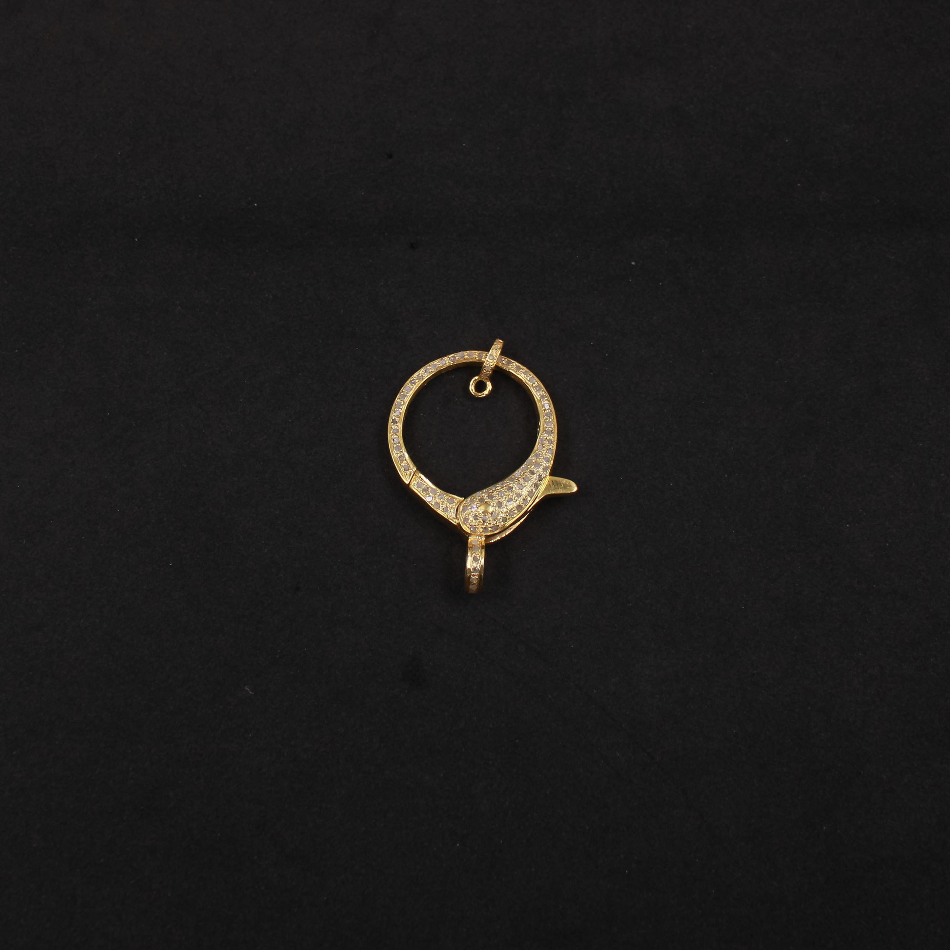 Gold pendant on a black background