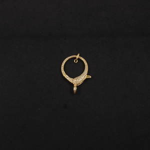 Gold pendant on a black background