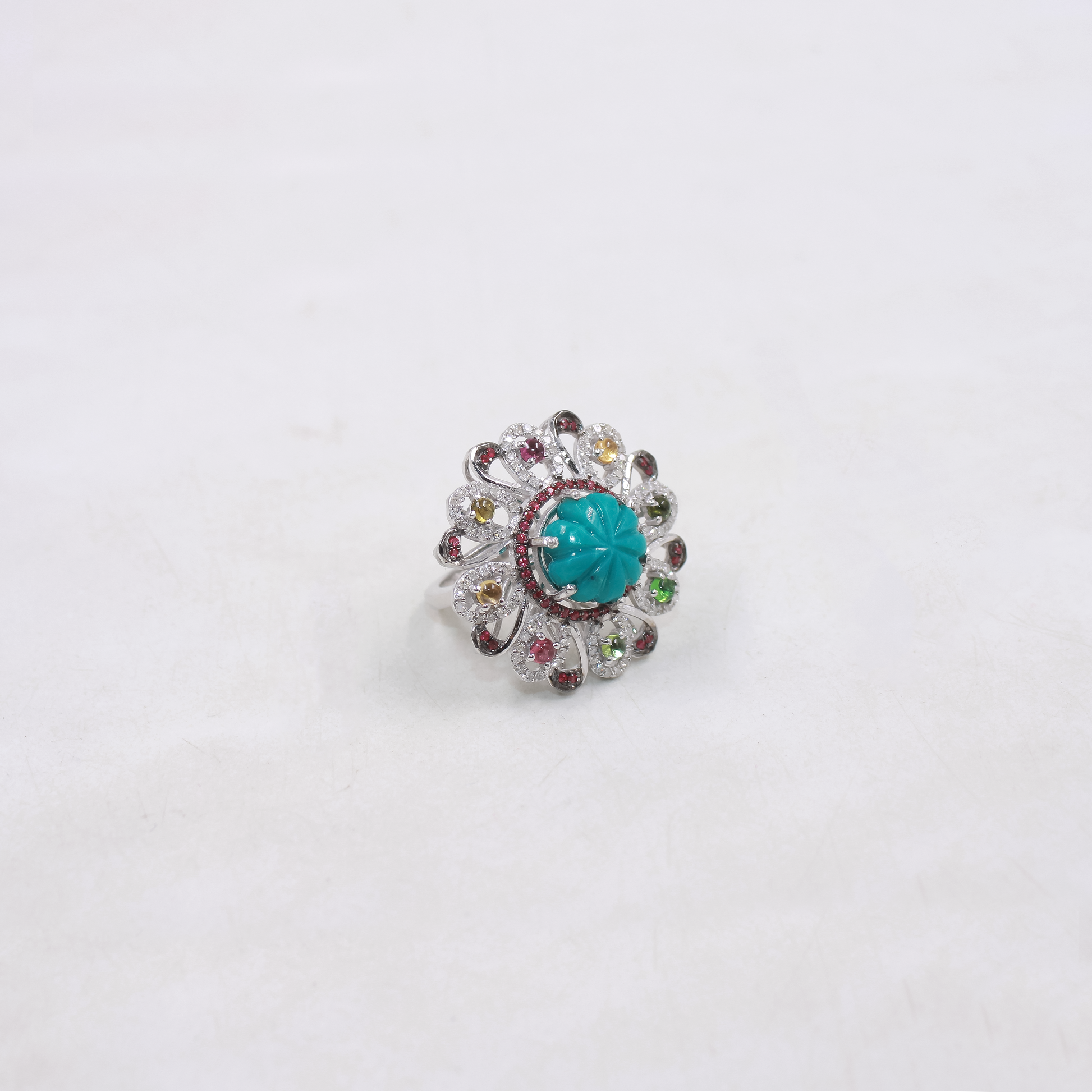 Vibrant gemstone cluster ring with ruby, turquoise and tourmaline stones