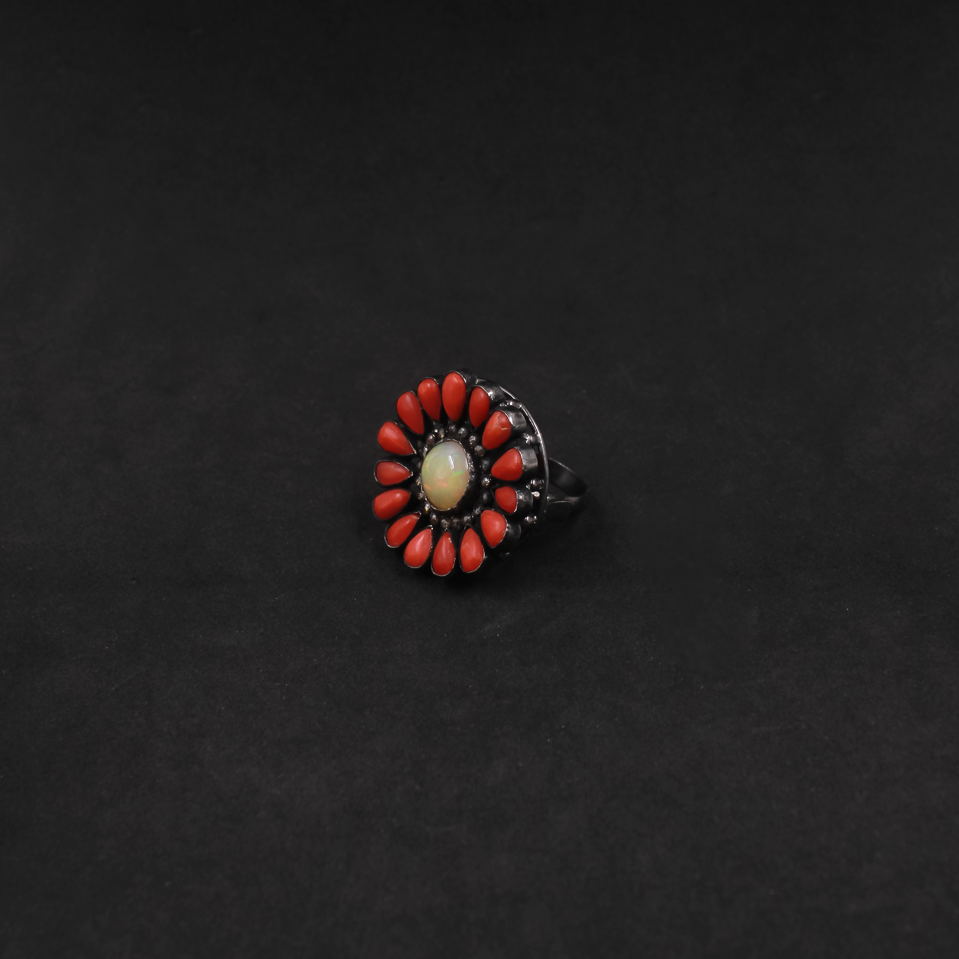 Handcrafted sterling silver ring with Ethiopian Opal, Coral, and Diamond accents