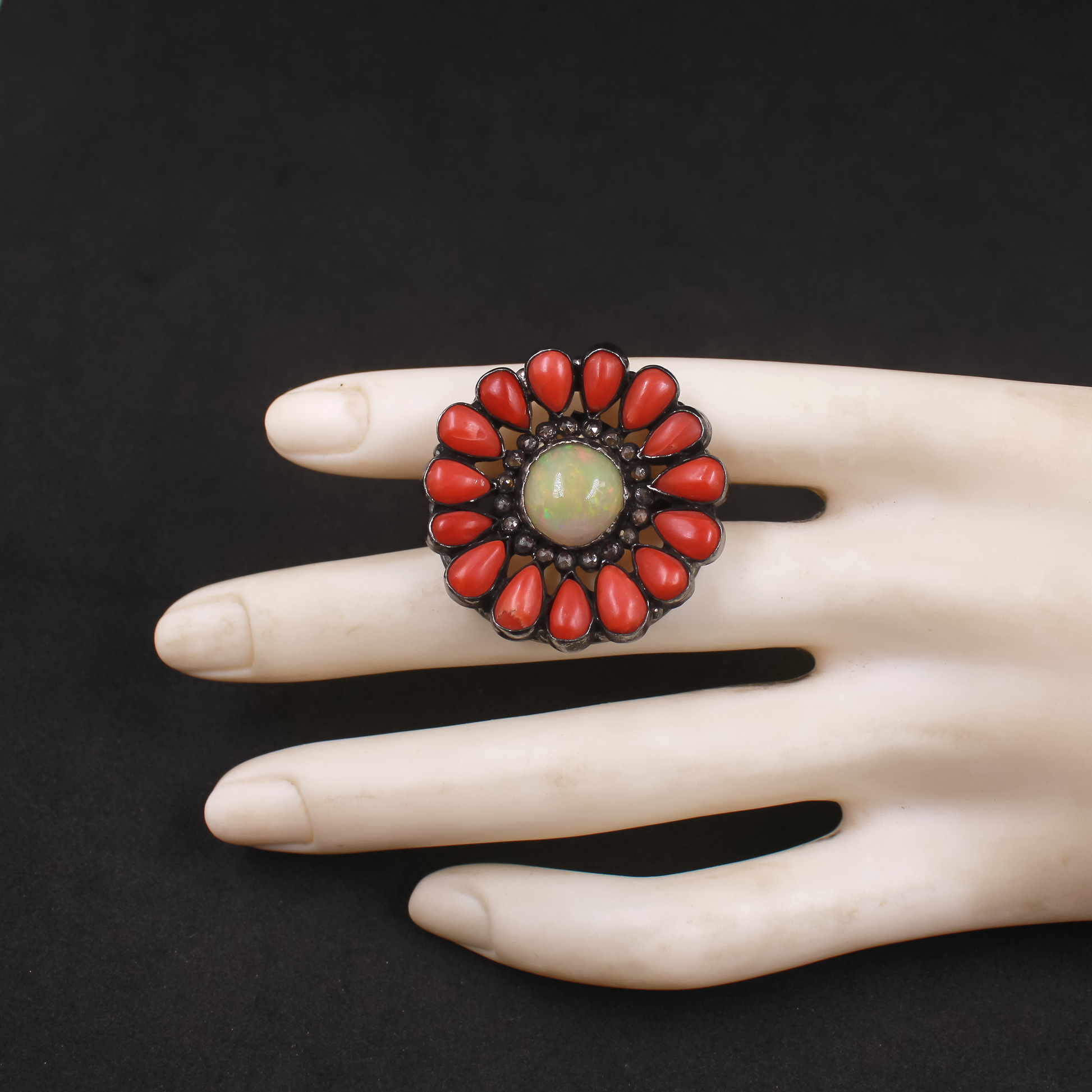 Artisan-made red coral and opal ring with sterling silver diamond accents