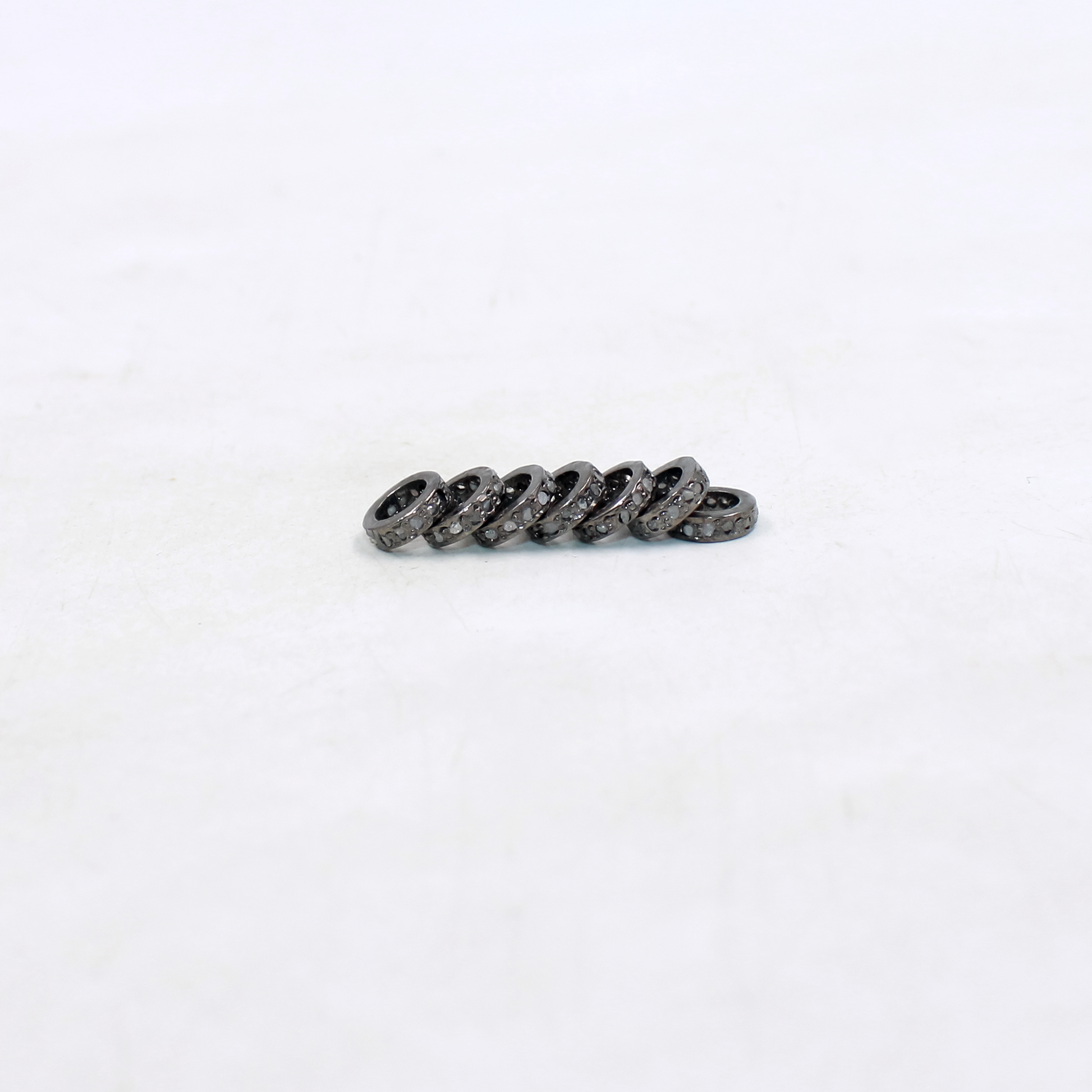Elegant handmade rondelle beads with natural diamonds.