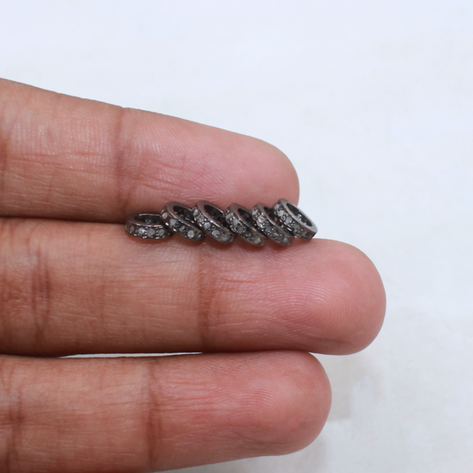 Pavé diamond rondelle spacer beads in oxidized sterling silver.