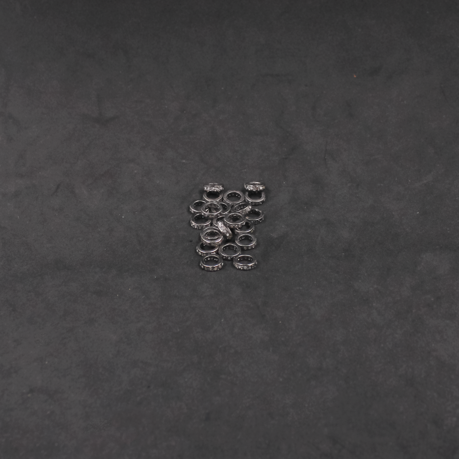 Pavé diamond beads in oxidized sterling silver for custom designs.