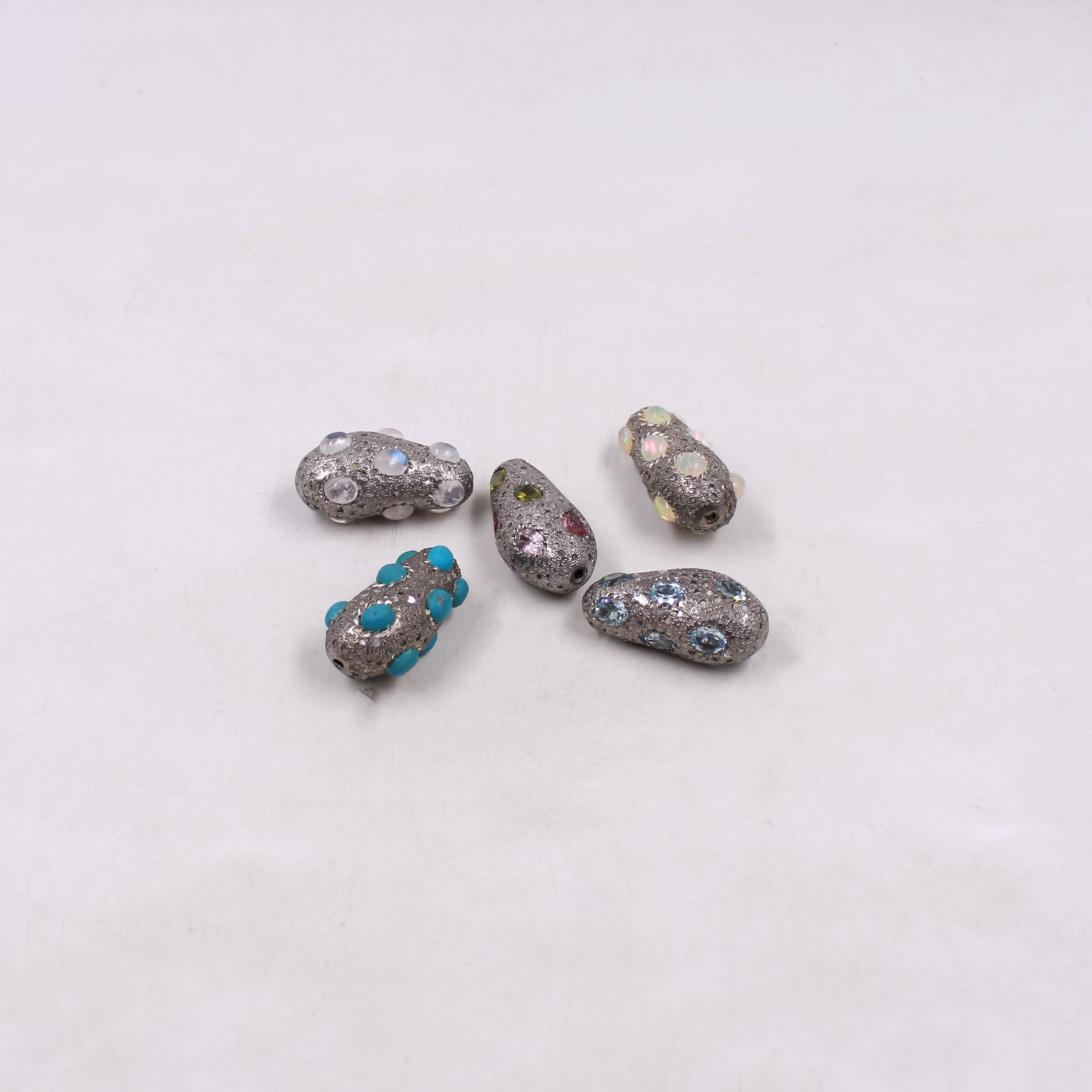 Handmade sterling silver bead with pave diamonds and turquoise accents for jewelry making.