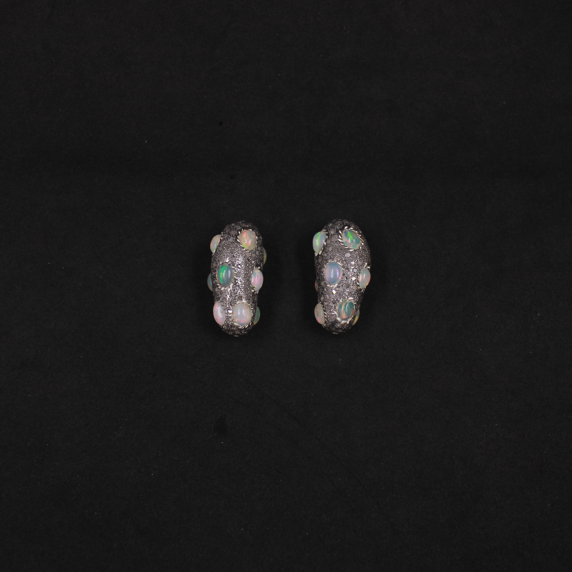 Rustic artisan bead featuring diamonds and opal gemstones in sterling silver.