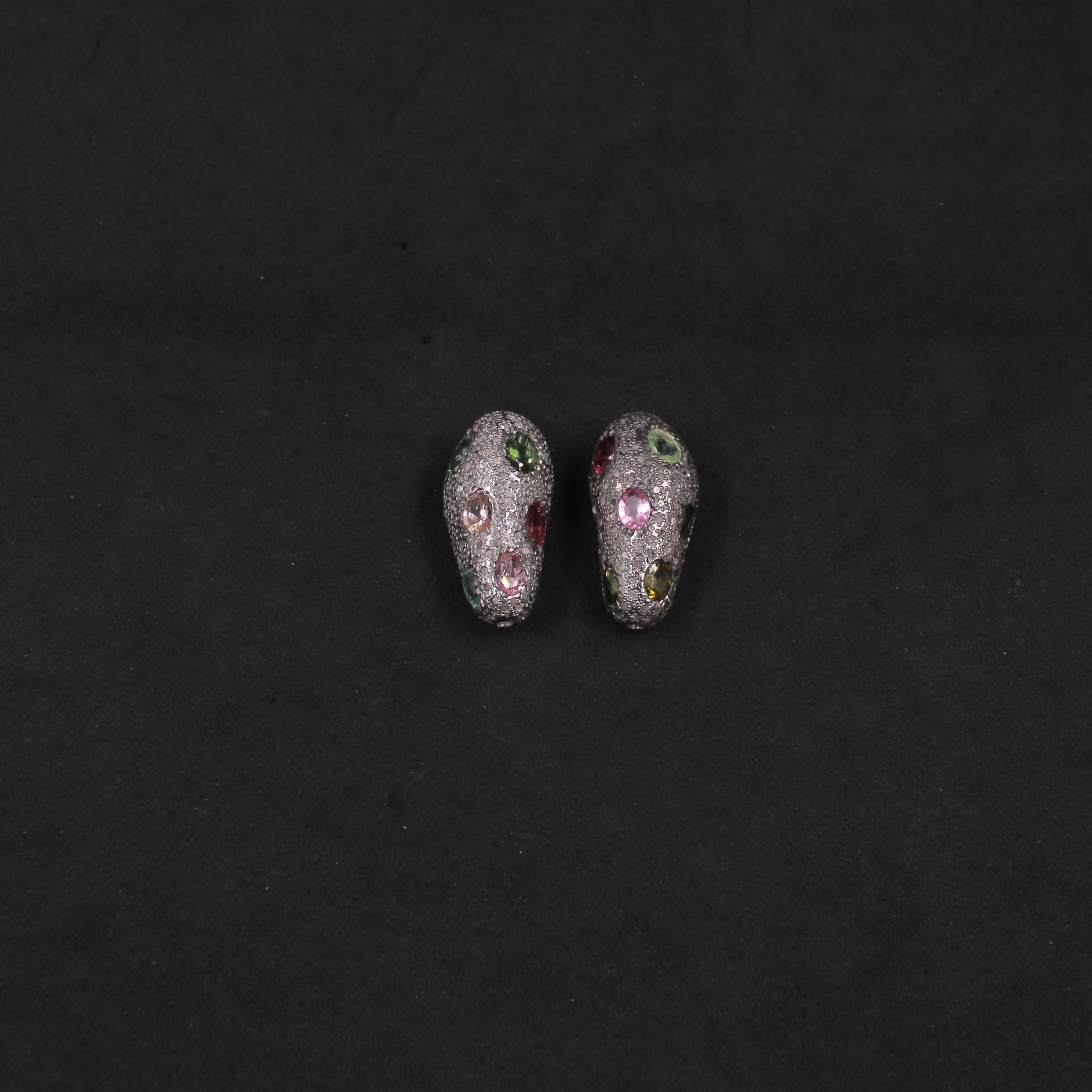 Handcrafted silver bead with natural diamonds and multi tourmaline -gemstone details.