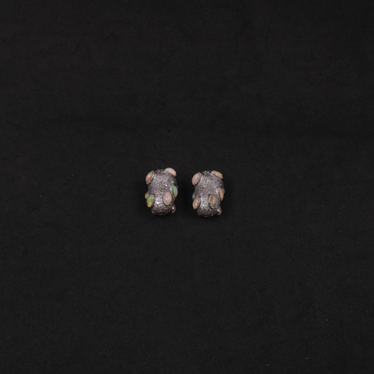 Jewelry supply beads crafted from 925 silver with gemstone accents.