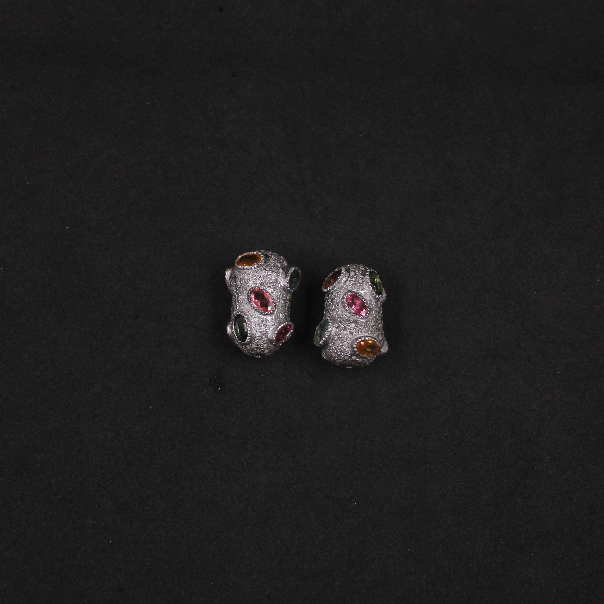 Antique-style bead charms set with natural multi tourmaline gemstones and diamonds.