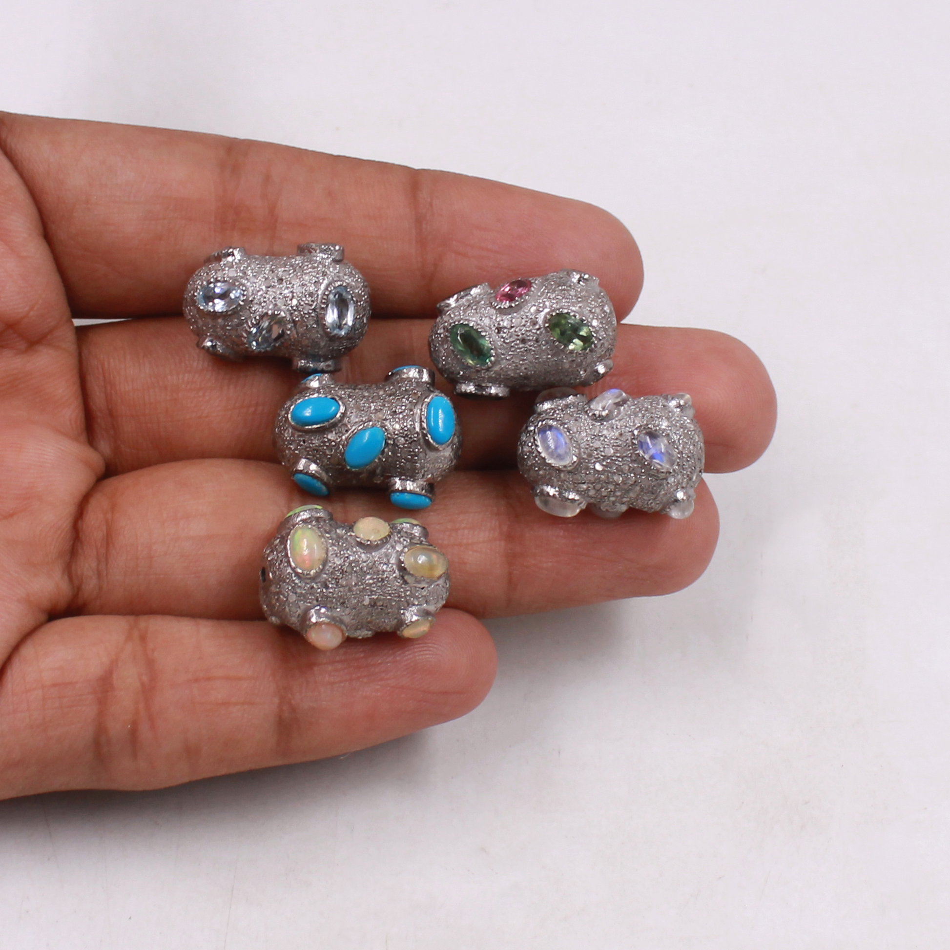 Multi-color gemstone beads with pave diamonds in artisan silver finish.