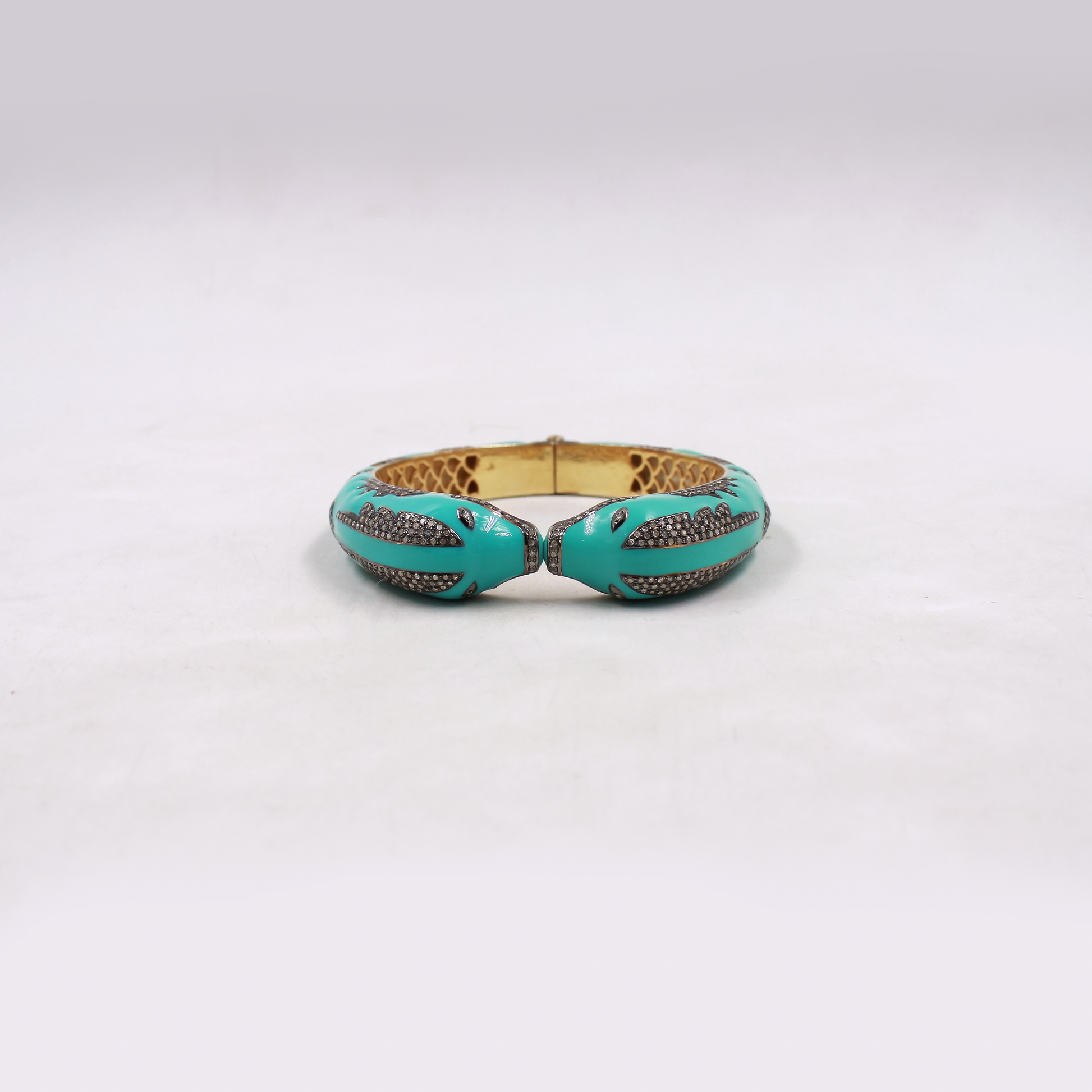 Ocean inspired dolphin bangle with blue enamel and diamond accents