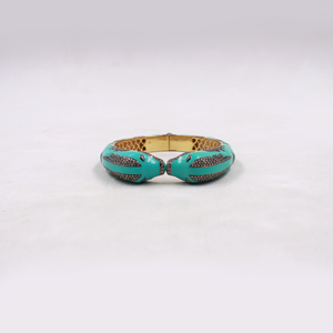 Ocean inspired dolphin bangle with blue enamel and diamond accents