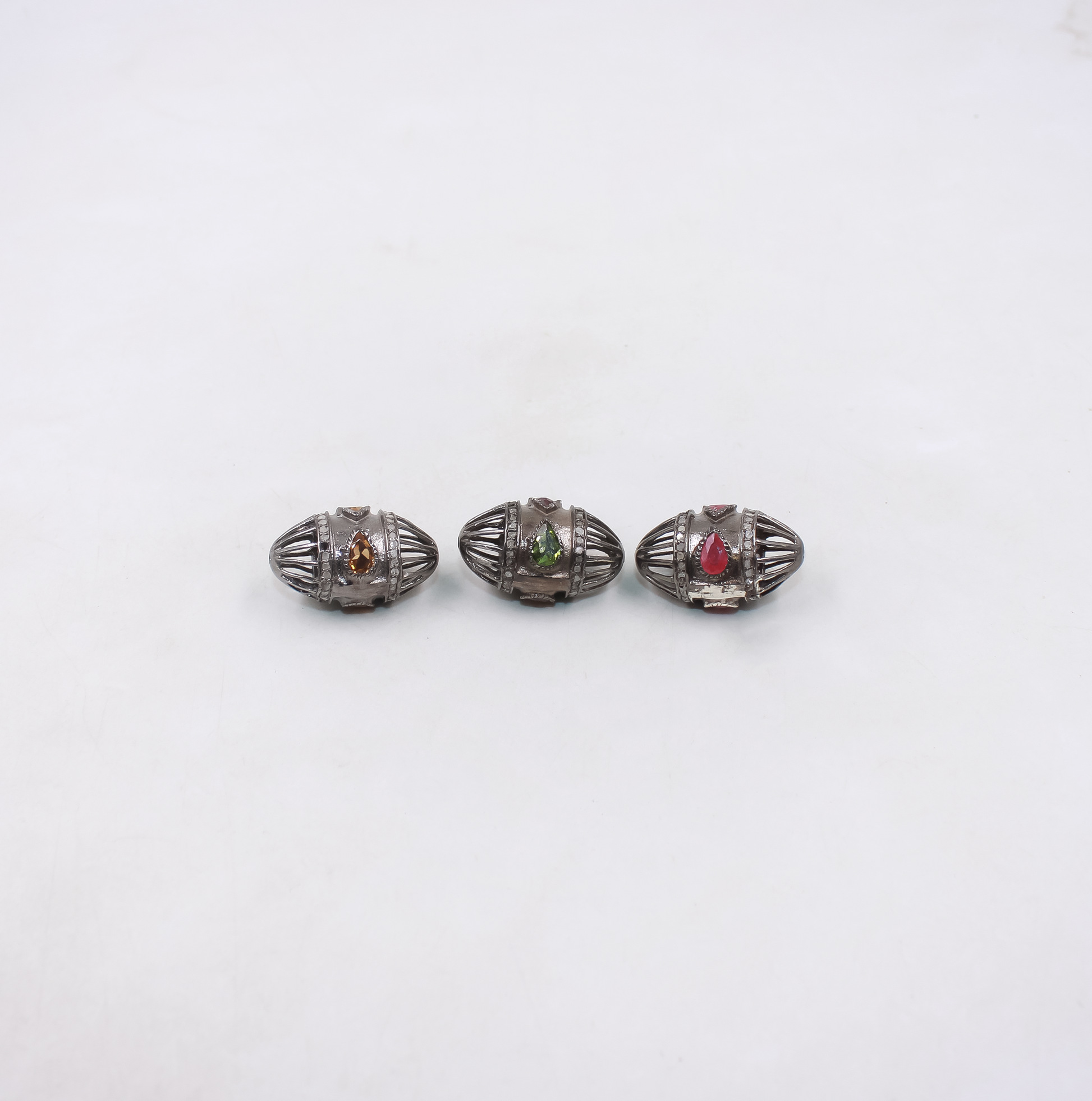 Luxury gemstone and diamond bead in oval silver design