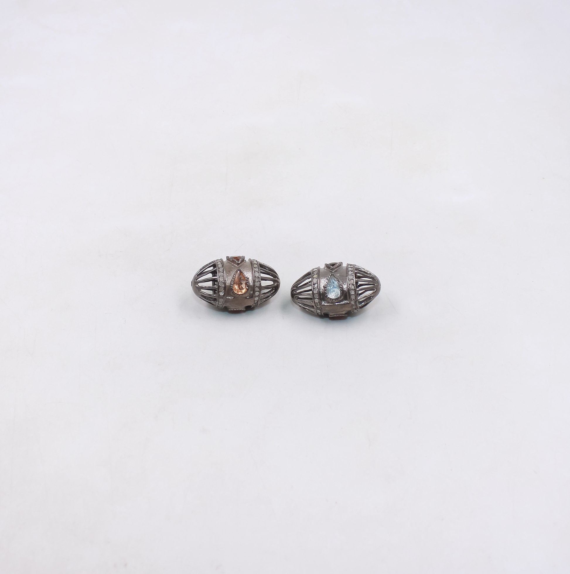 Handmade oval cage bead with gemstone and diamonds