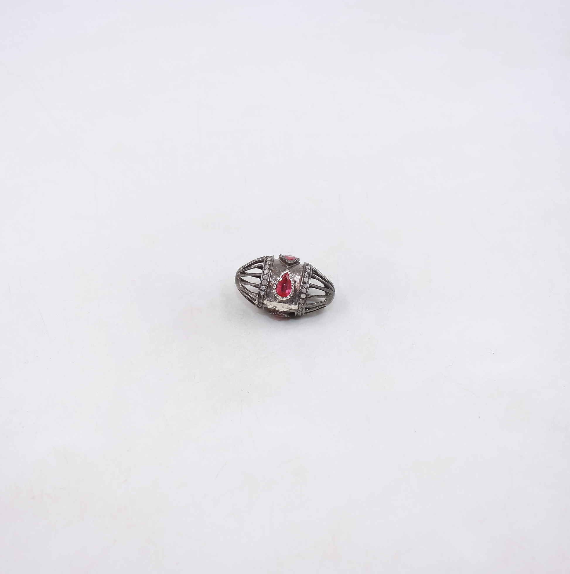 Handmade sterling silver cage bead with ruby and diamonds