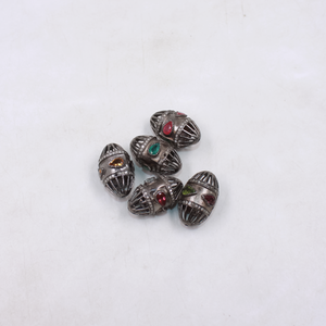 Oval cage style bead with emerald and pave diamonds in sterling silver