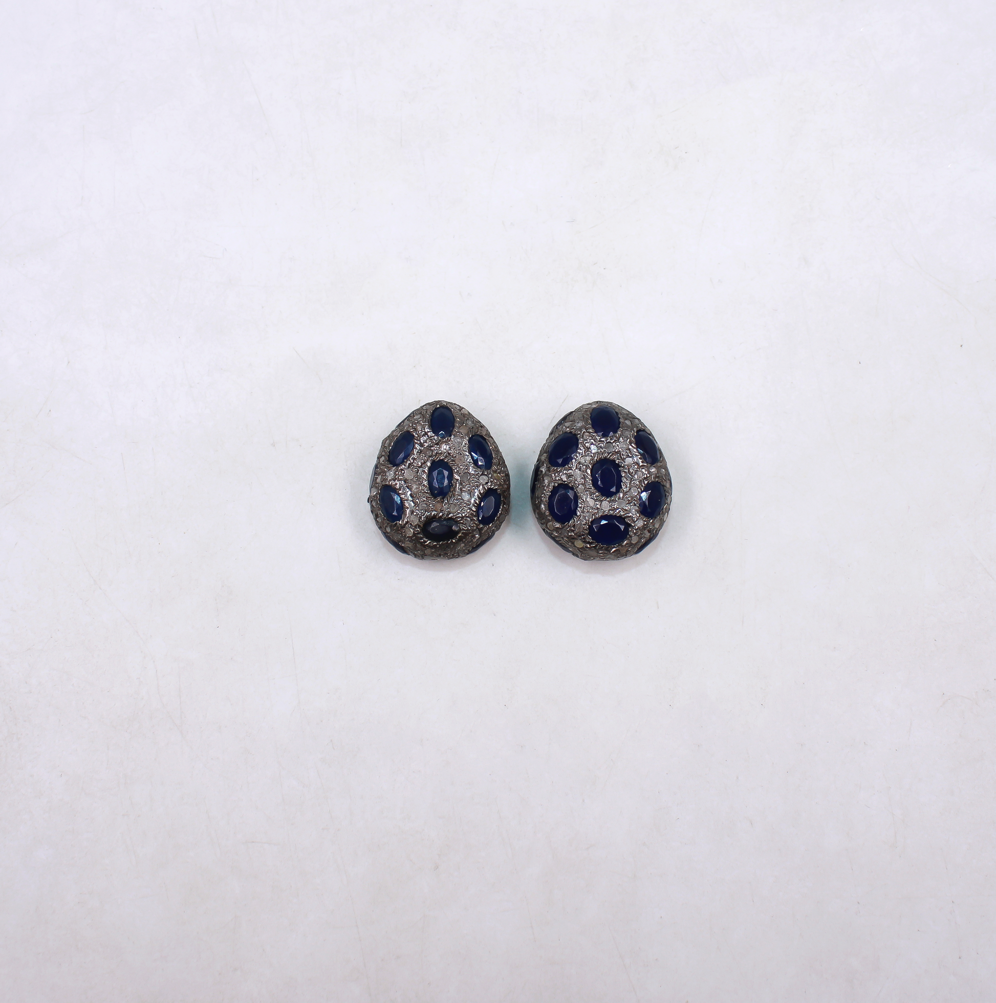 Blue sapphire bead with natural diamonds set in sterling silver