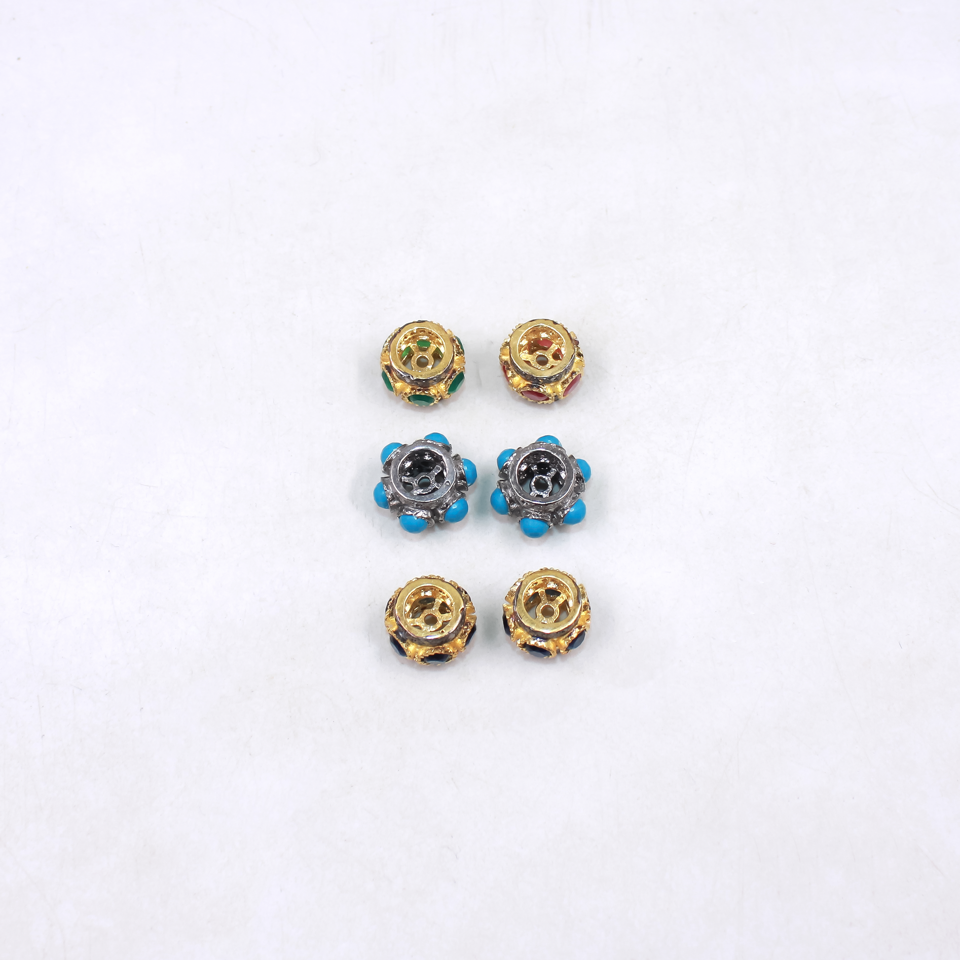 Set of small decorative beads for bracelet on a white background