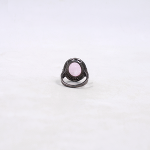 Ring with a pink gemstone on a white background