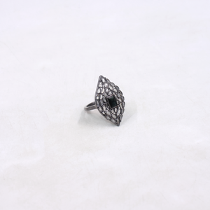 Silver ring with a black gemstone on a white background