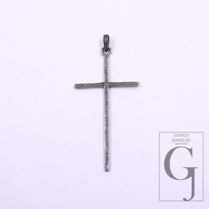 Silver cross pendant on a light gray background with Gemco Jewelry Services logo.