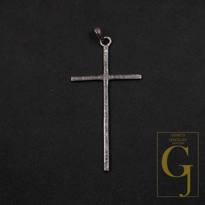Silver cross pendant on a black background with Gemco Jewelry New York logo.