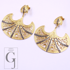 Gold earrings with intricate designs on a white background, featuring the Gemco Jewelry New York logo.