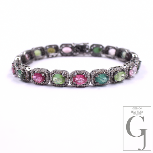 Bracelet with multicolored gemstones on a white background, featuring the Gemco Jewelry logo.