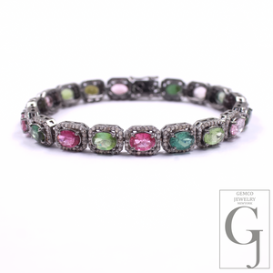 Bracelet with multicolored gemstones on a white background, featuring the Gemco Jewelry logo.