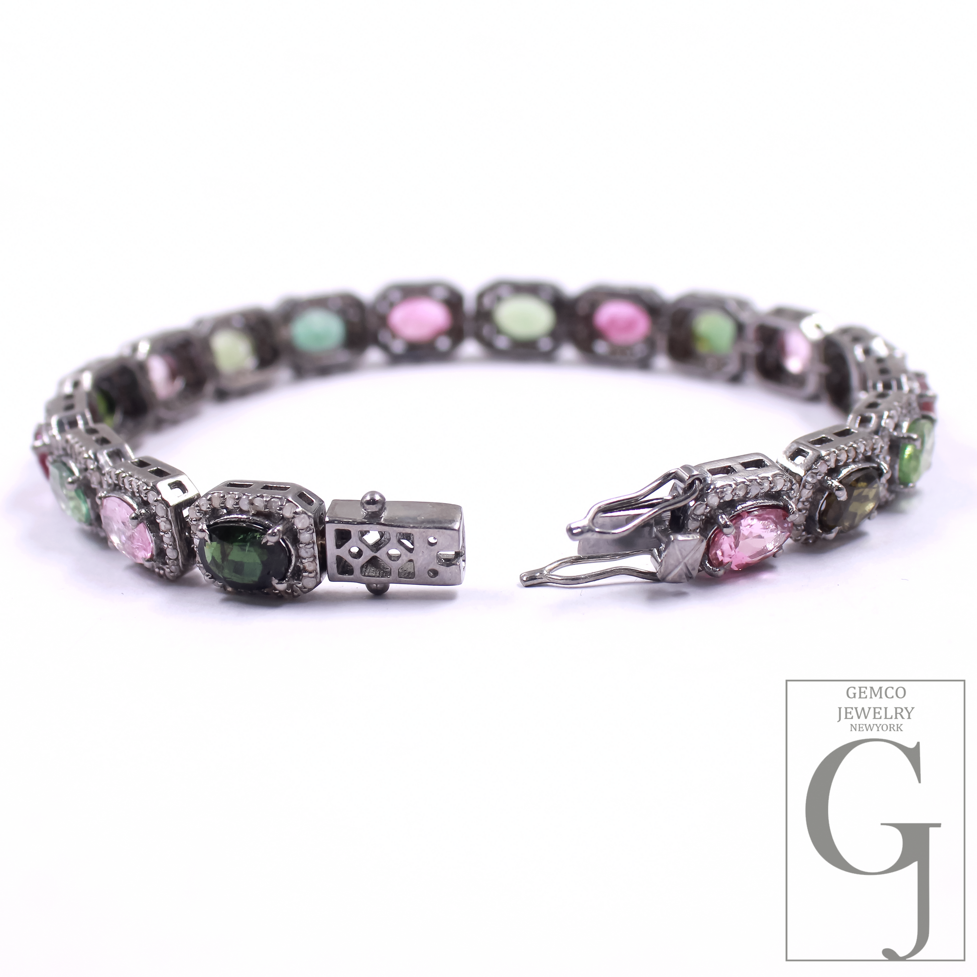 Multicolored gemstone bracelet with silver on a white background, featuring the Gemco Jewelry logo.