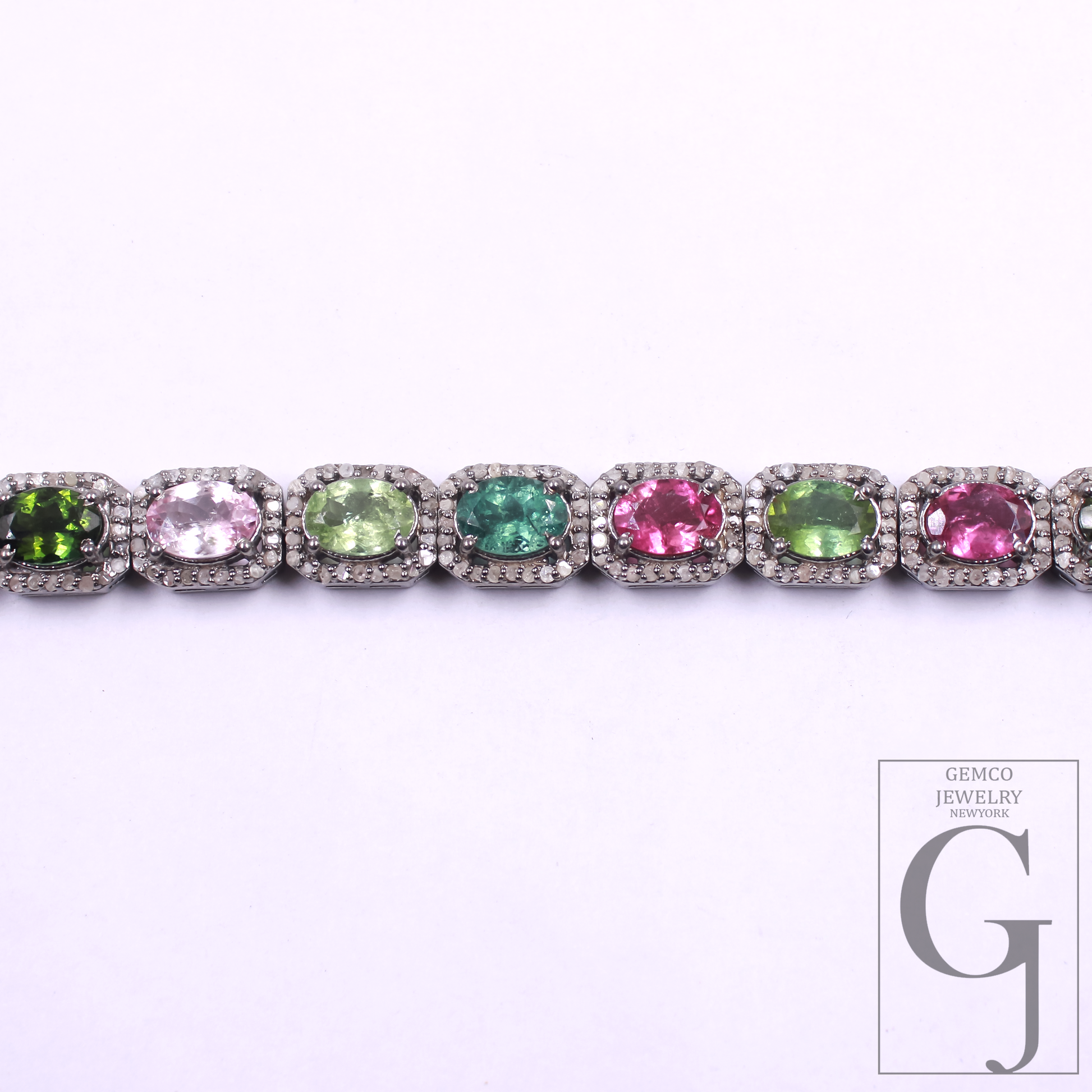 Jewelry bracelet with multicolor gemstones on a white background