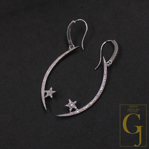 Silver earrings with star designs on a dark background, featuring Gemco Jewelry logo.