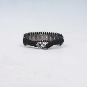 Black and silver bracelet on a white background
